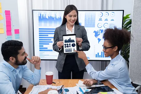 young-asian-businesswoman-presenting-data-analysis-dashboard-tv-concord